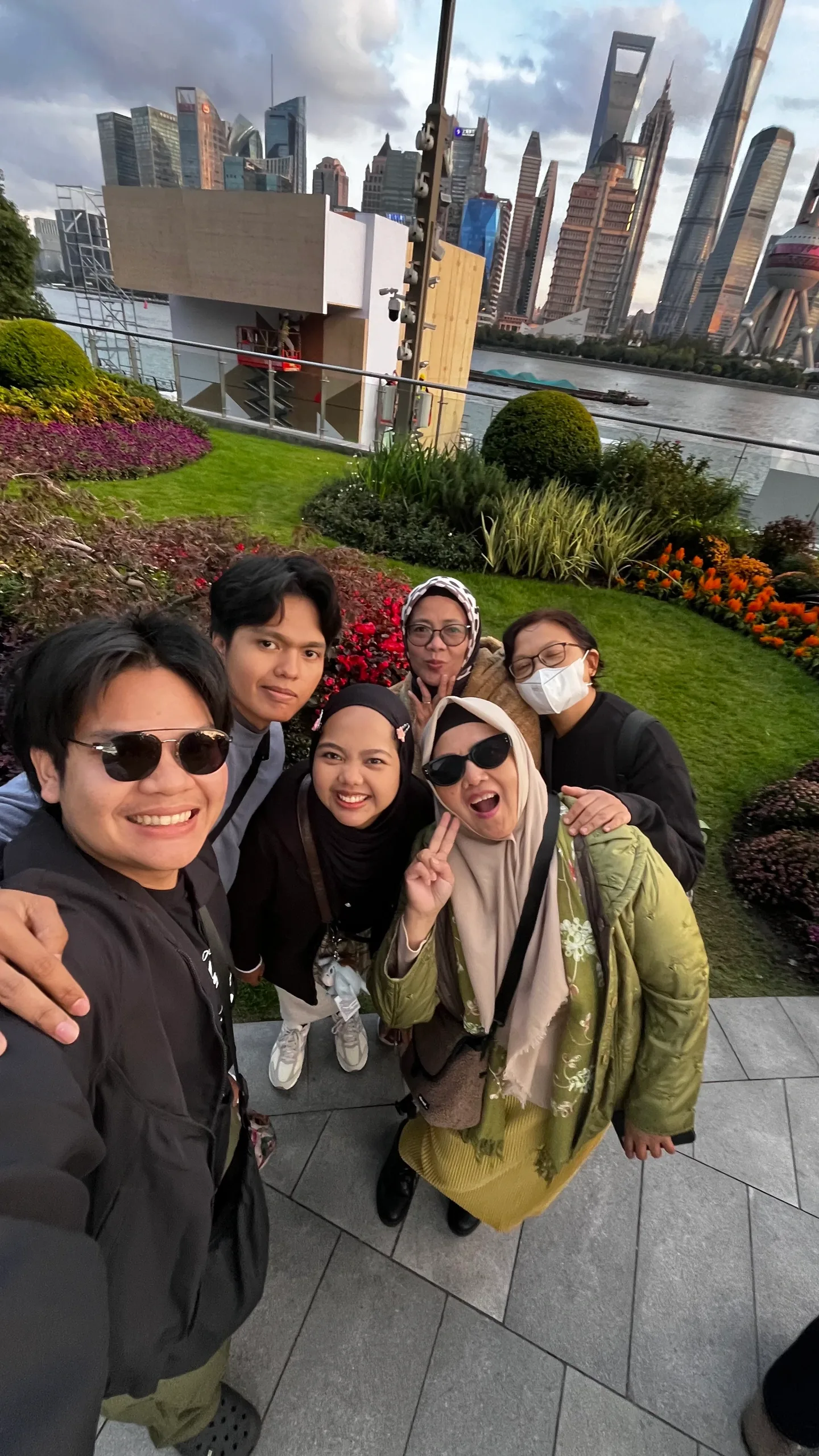 A group photograph with Shanghai in the background